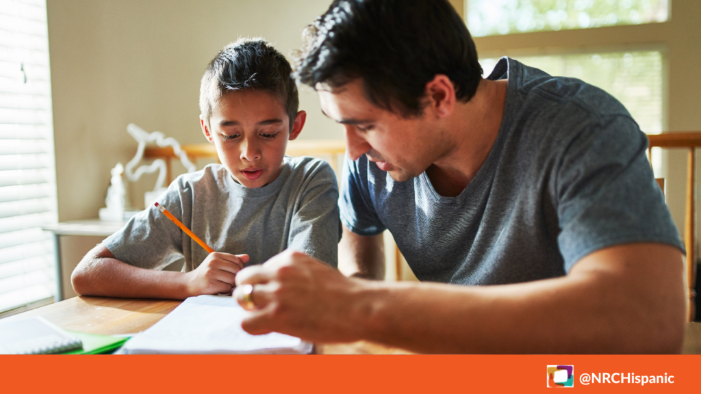 A man and his kid look work on paperwork